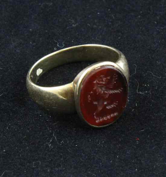 Appraisal: A gold signet ring inset with an agate intaglio carved