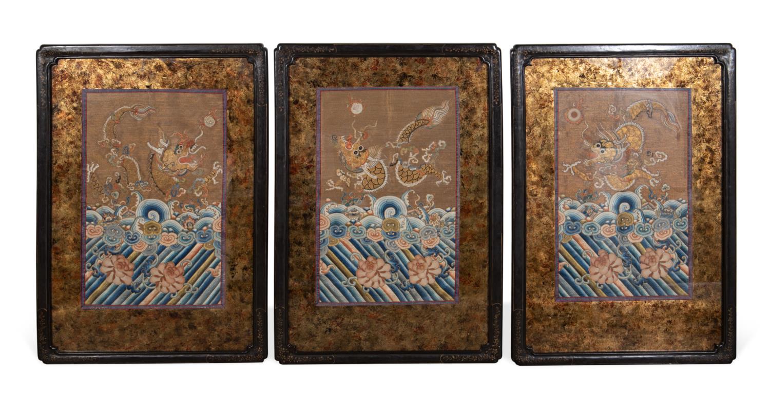 Appraisal: THREE FRAMED CHINESE EMBROIDERED SILK PANELS Three Chinese embroidered dragon