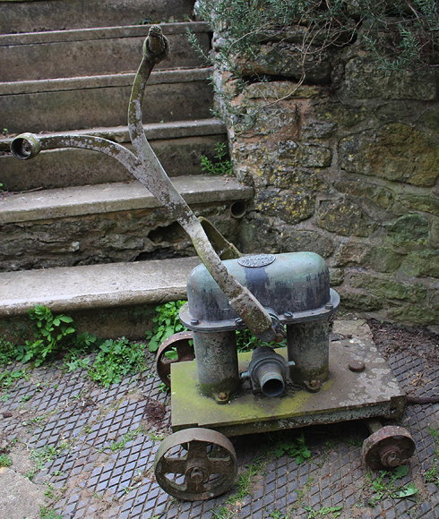 Appraisal: AN OLD CAST IRON AND BRASS HAND PUMP by J