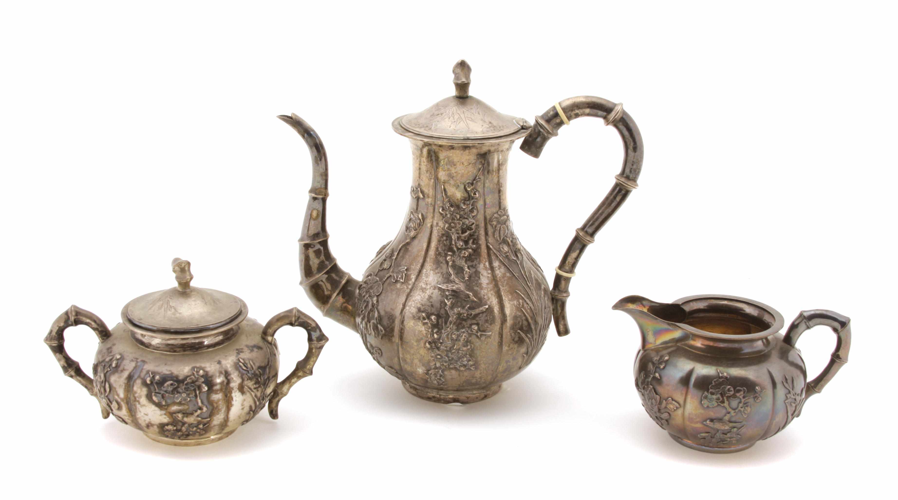 Appraisal: A Chinese Export silver assembled three piece coffee service Lianchang