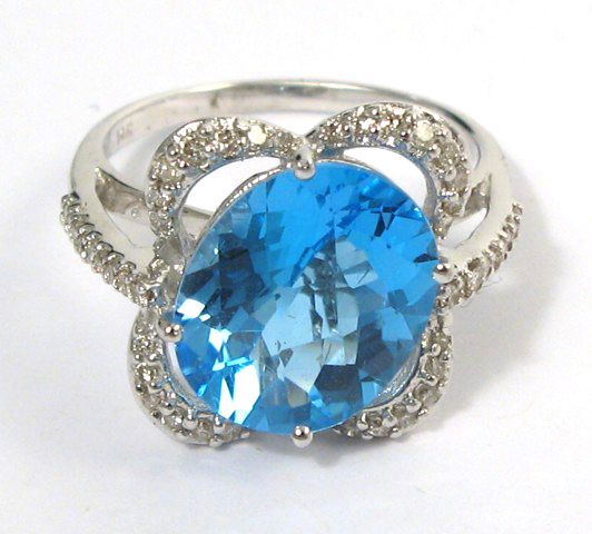 Appraisal: BLUE TOPAZ AND DIAMOND RING The k white gold band