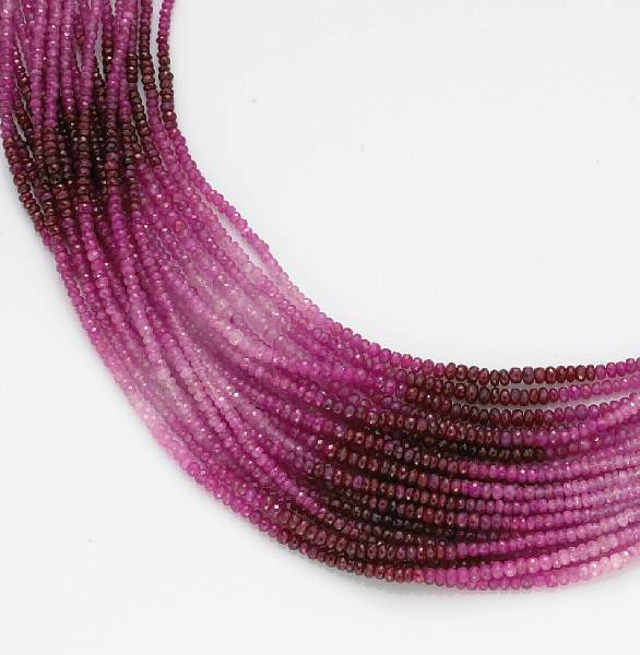 Appraisal: A pink sapphire ruby and diamond torsade necklace mounted in