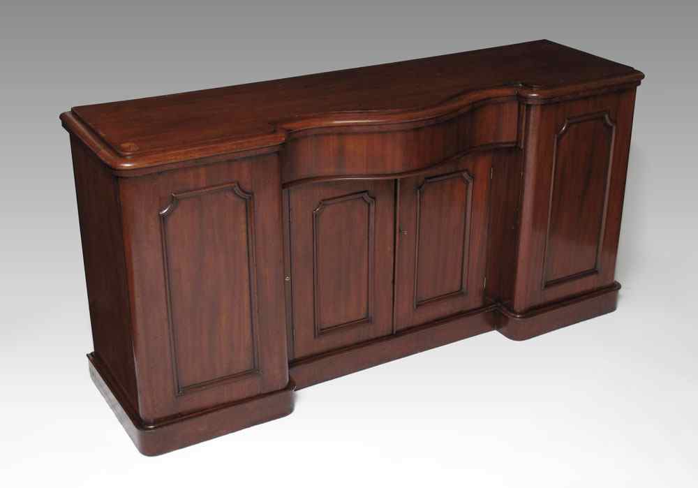 Appraisal: VICTORIAN MAHOGANY DOOR BREAKFRONT SIDEBOARD Serpentine top with serpentine central