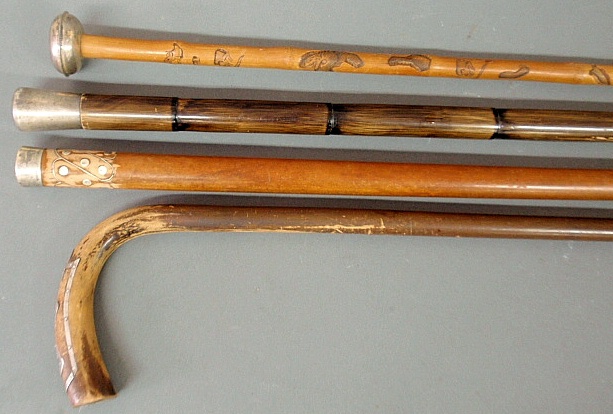 Appraisal: - Four silver tipped walking sticks late th c longest