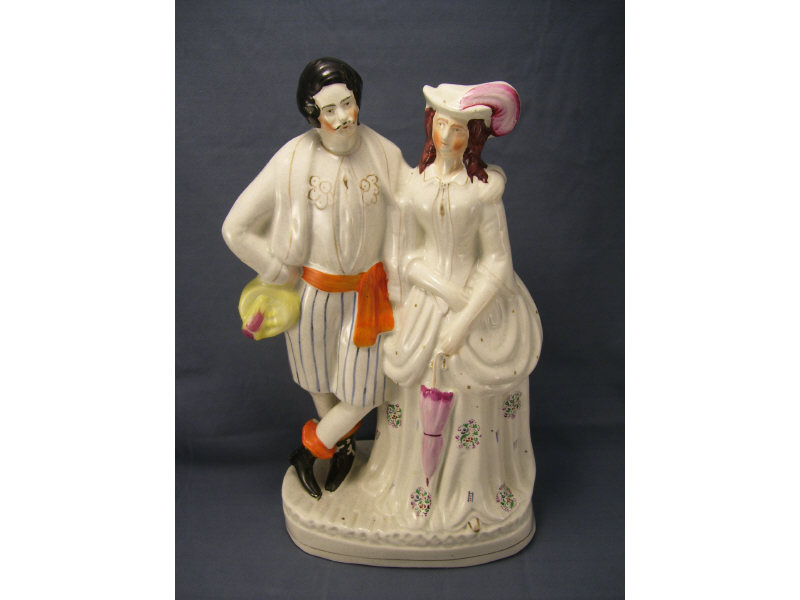 Appraisal: Staffordshire Couple Figure Single figure Measures high