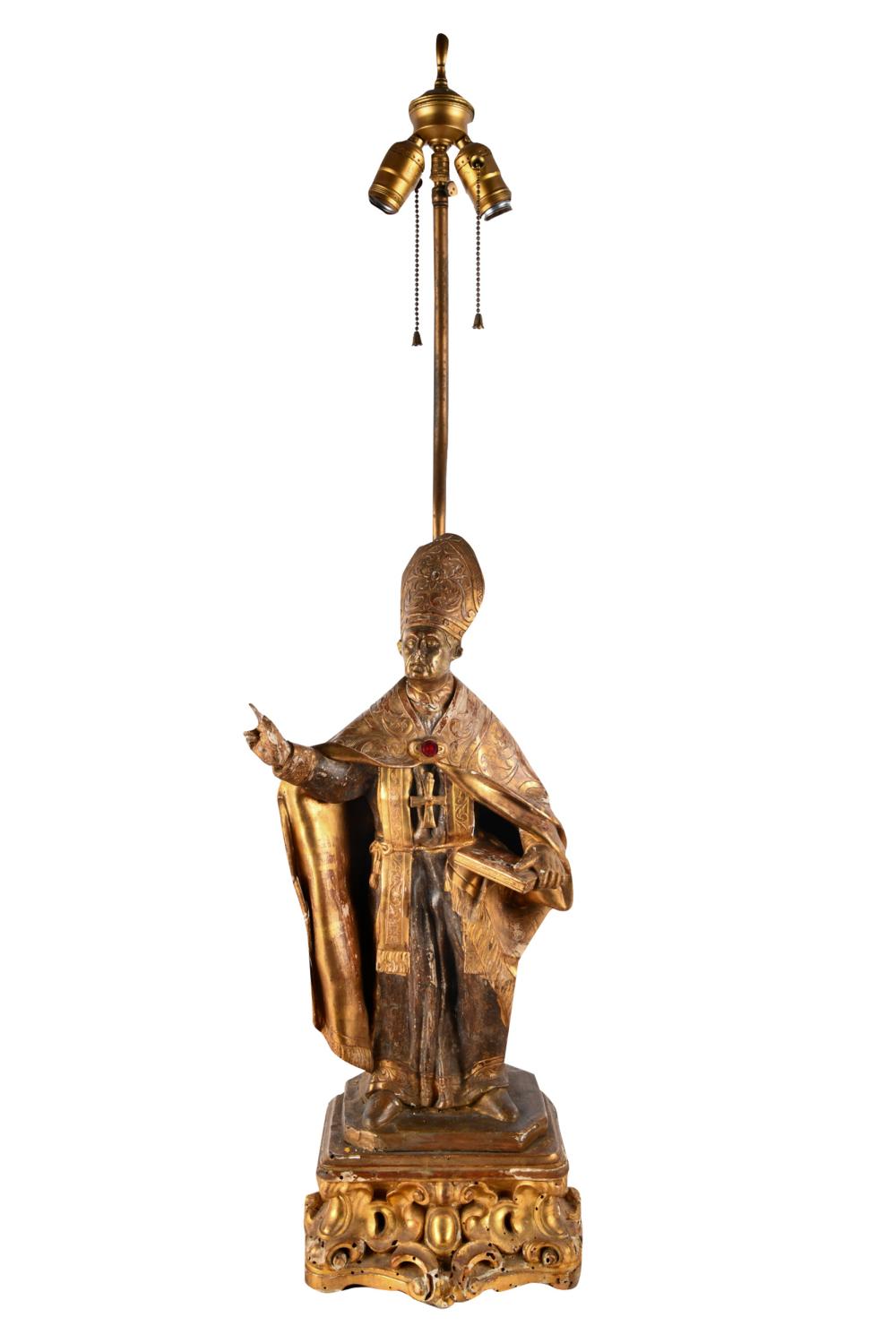 Appraisal: GILT FIGURAL TABLE LAMPmodeled as a cleric Condition insect holes