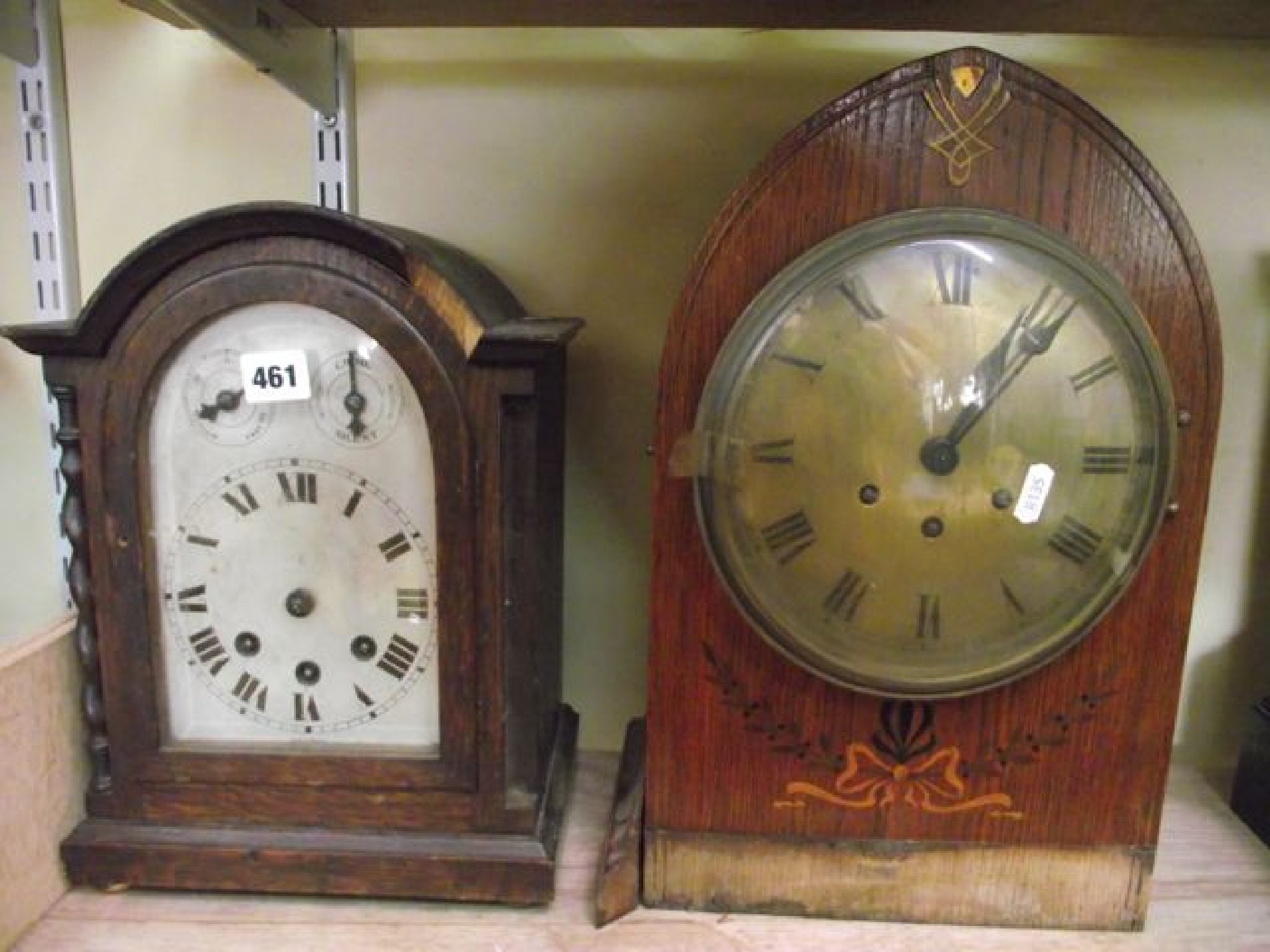 Appraisal: An Edwardian bracket clock with a lancet shaped case brass