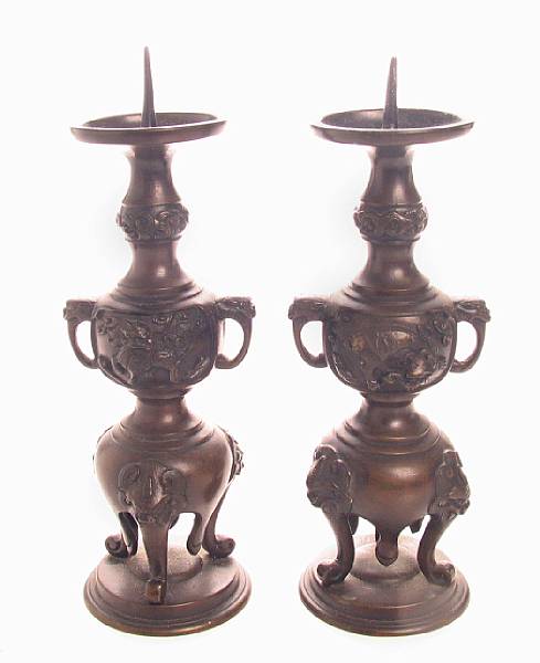 Appraisal: A pair of Japanese bronze candlesticks height in width in'