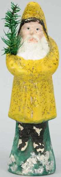 Appraisal: Paper Mache Belsnickle with Yellow Coat Holding fir tree Some