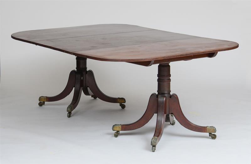 Appraisal: REGENCY MAHOGANY TWO-PEDESTAL DINING TABLE Raised on turned pedestal ending