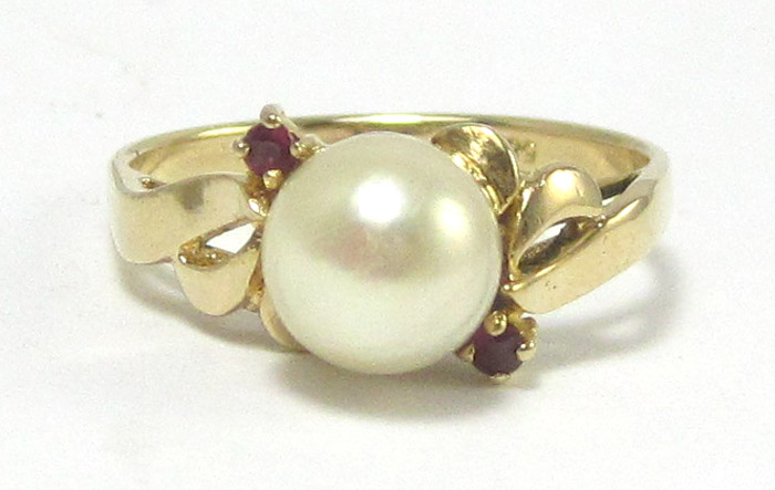 Appraisal: PEARL RUBY AND FOURTEEN KARAT GOLD RING set with two