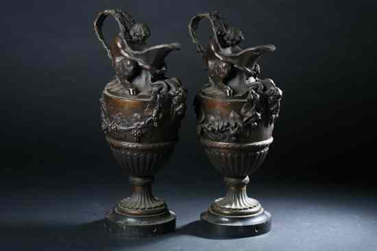 Appraisal: PAIR FRENCH BRONZE EWERS th century Draped with generous ivy