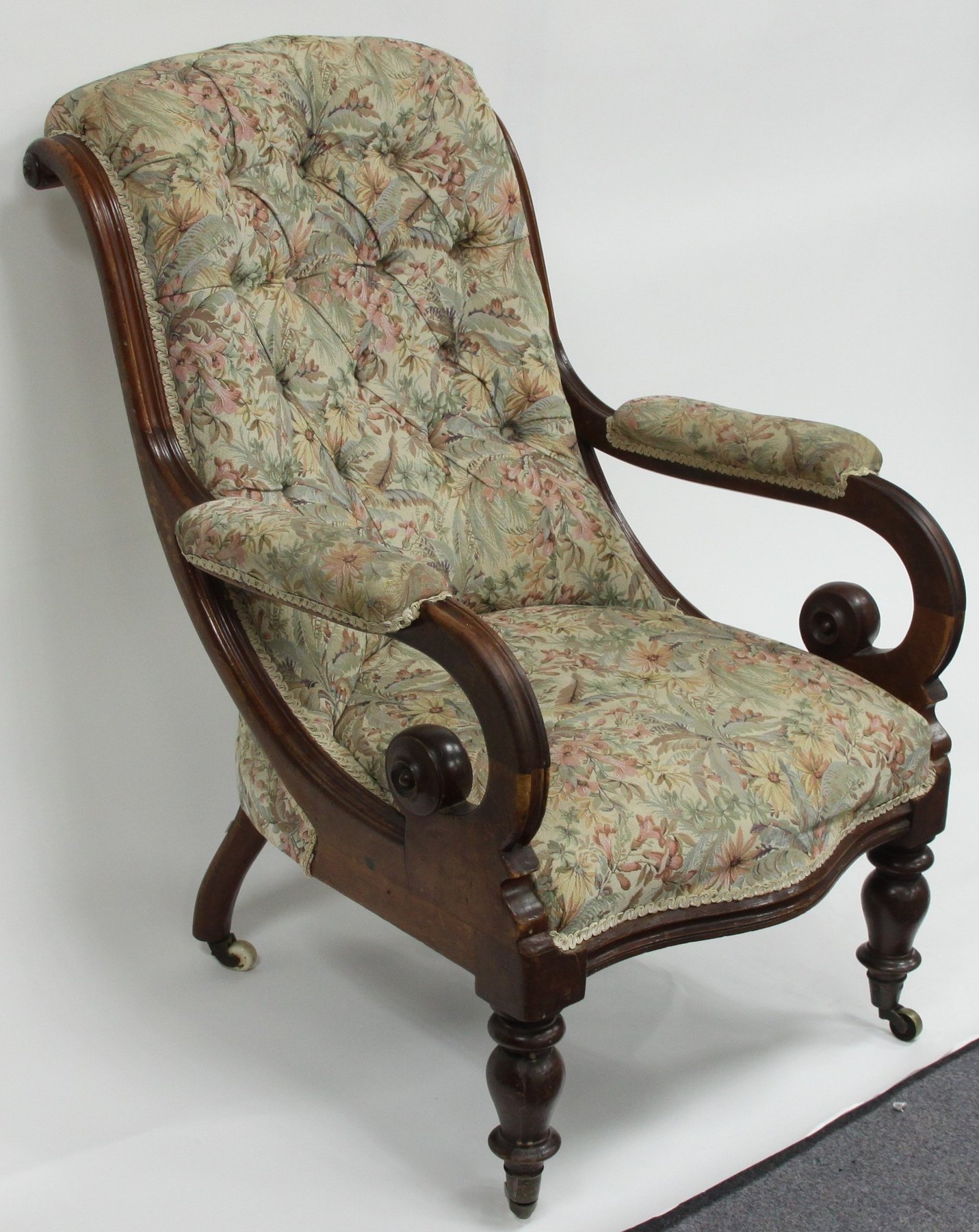 Appraisal: An early button upholstered armchair with open scroll arms and