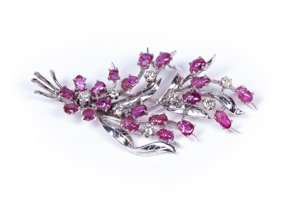 Appraisal: KT WHITE GOLD CARVED RUBY AND FACETED DIAMOND BROOCH kt