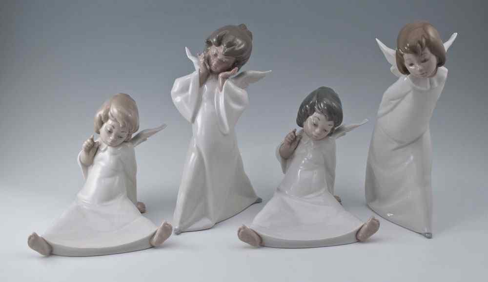 Appraisal: LLADRO ANGEL FIGURINES BY SALVADOR DEBON WONDERING CHERUB brown hair