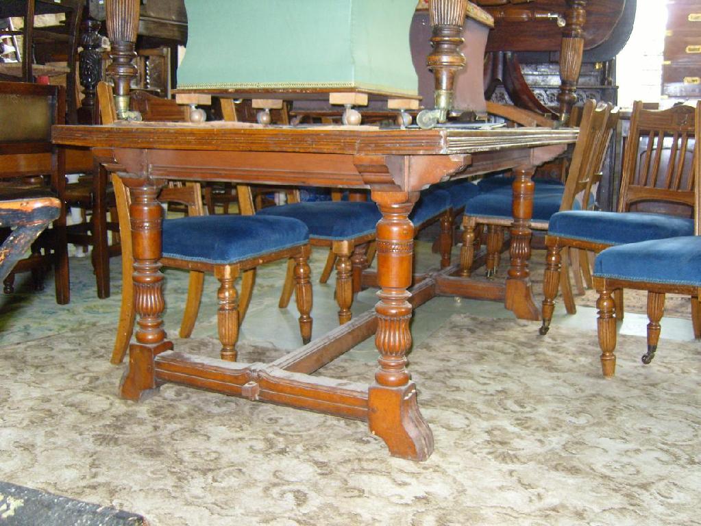 Appraisal: A substantial Edwardian oak library table with inset top raised