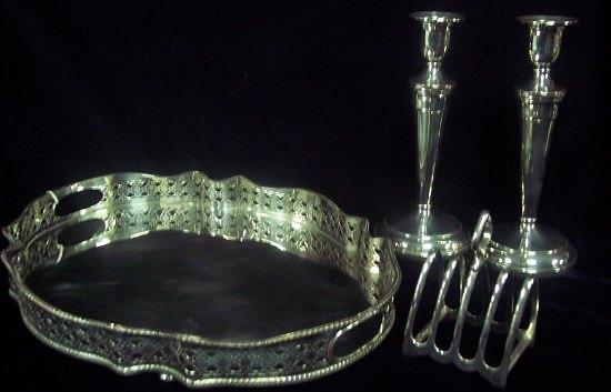 Appraisal: A shaped oval tray with pierced border a five-bar toast