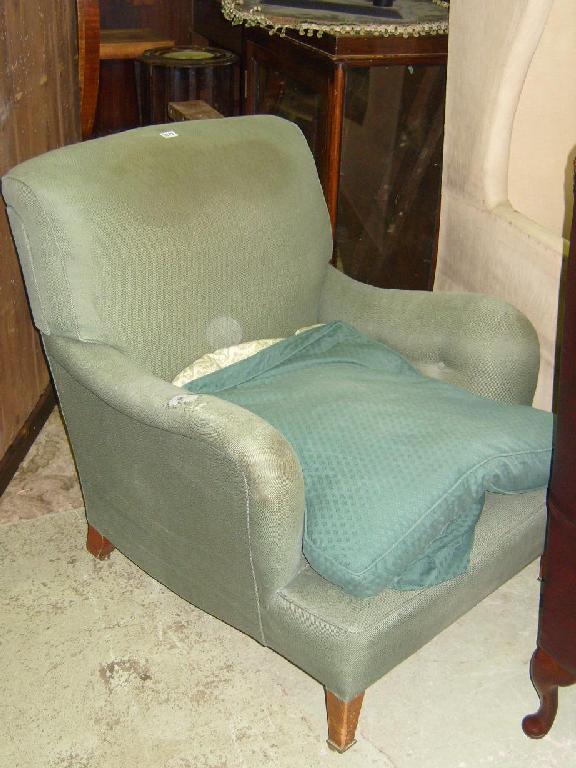 Appraisal: A Victorian armchair on square taper supports by Howard Sons