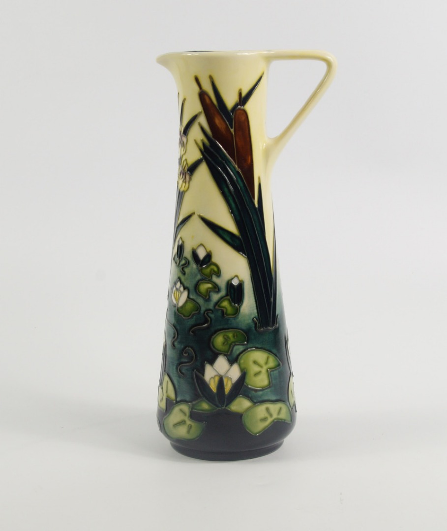 Appraisal: A Moorcroft pottery jug of tapering form decorated with water