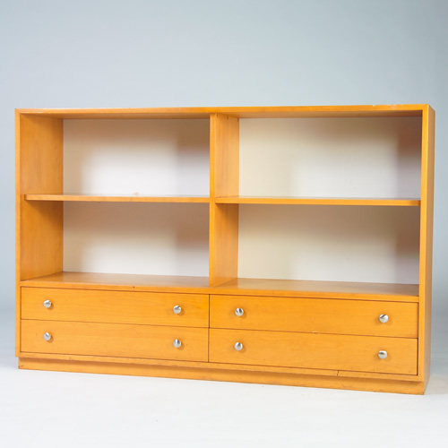 Appraisal: JOE CARR Custom-designed and fabricated blonde wood bookcase with sliding