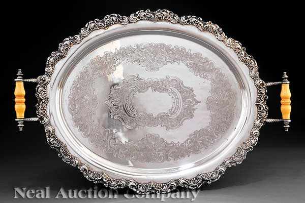 Appraisal: A Silverplate Serving Tray oval with scroll border and celluloid