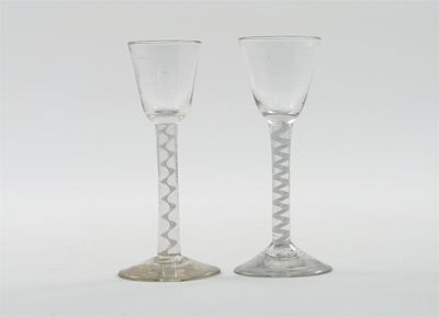 Appraisal: Two wine glasses with slightly flared bowls raised on differing