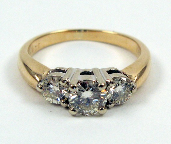 Appraisal: DIAMOND AND FOURTEEN KARAT GOLD RING set with three round