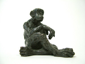 Appraisal: Real-A bronze sculpture of a seated chimpanzee indistinctly signed and