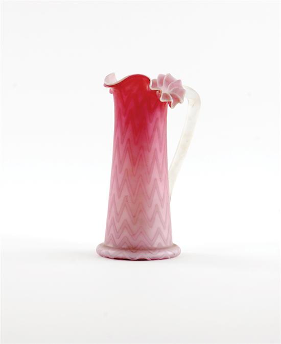 Appraisal: Cranberry satin glass pitcher early th century ruffled rim on