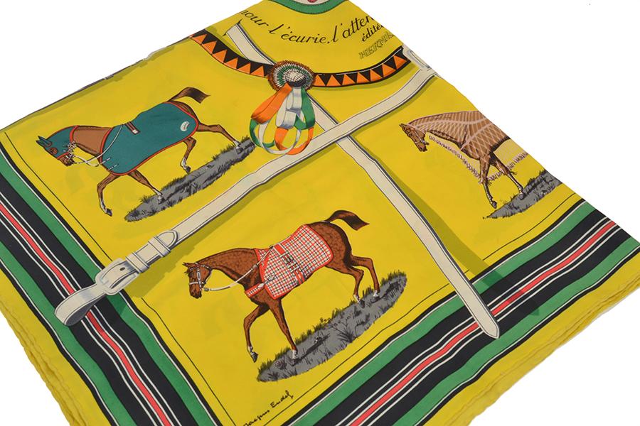 Appraisal: A SILK SCARF BY HERMES 'Couvertures et tenues de jour