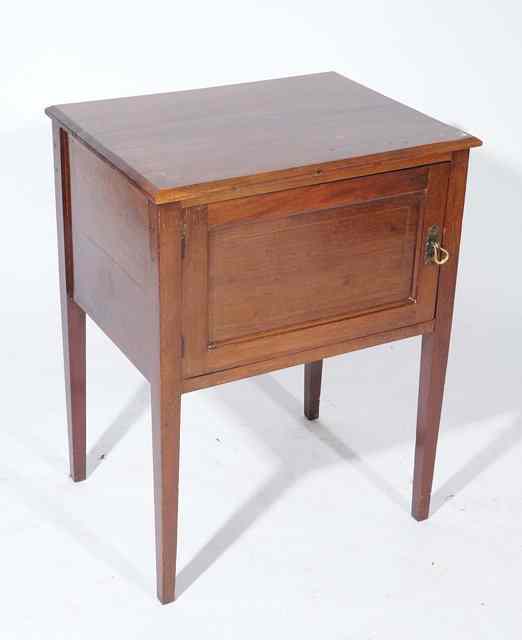 Appraisal: A MAHOGANY POT CUPBOARD with single panelled door standing on