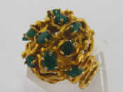 Appraisal: A s carat yellow gold and emerald bombe ring the