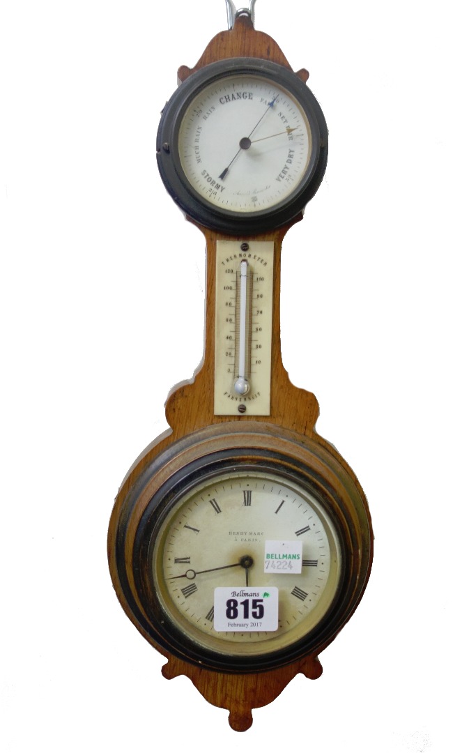 Appraisal: A French oak cased clock barometer of 'banjo' form th