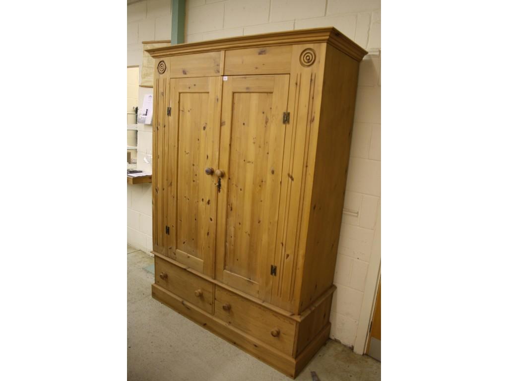 Appraisal: Modern pine double wardrobe fitted with two frieze drawers wide