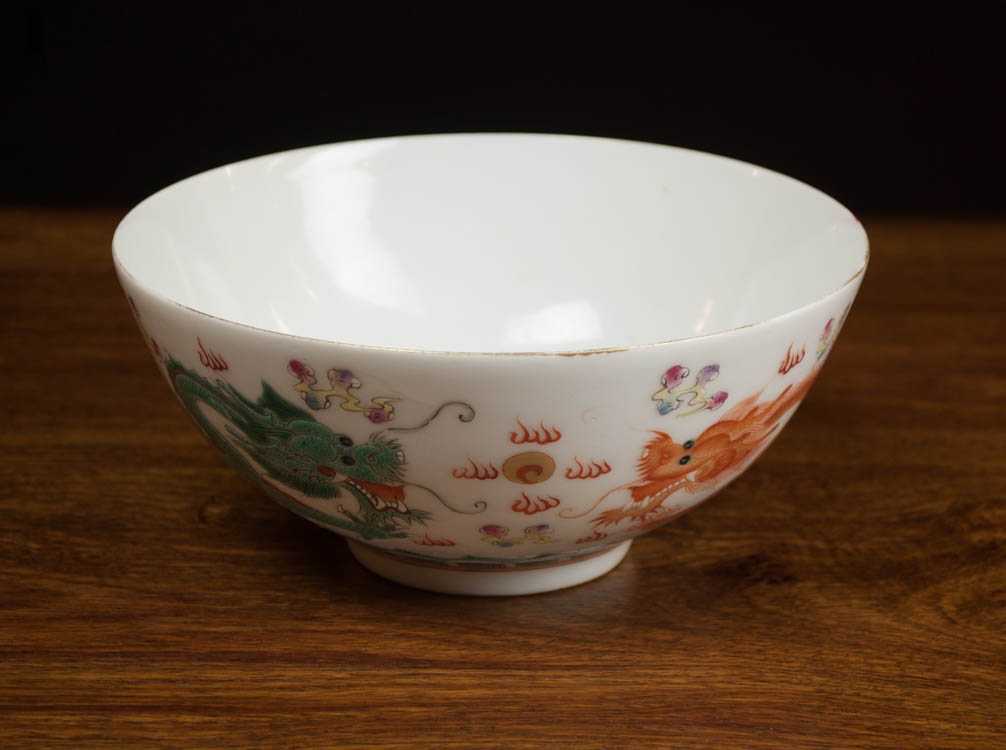 Appraisal: CHINESE QING PORCELAIN BOWL with two dragons chasing the flaming