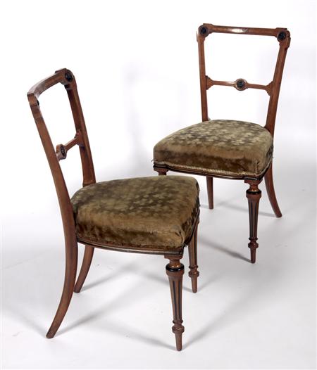 Appraisal: A set of four Victorian walnut side chairs the crossbanded