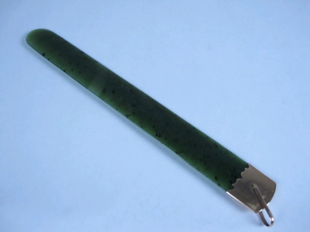 Appraisal: A gold mounted spinach jade Page Turner the mount with