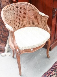 Appraisal: A Louis XV carved beech and caned bergere the curved