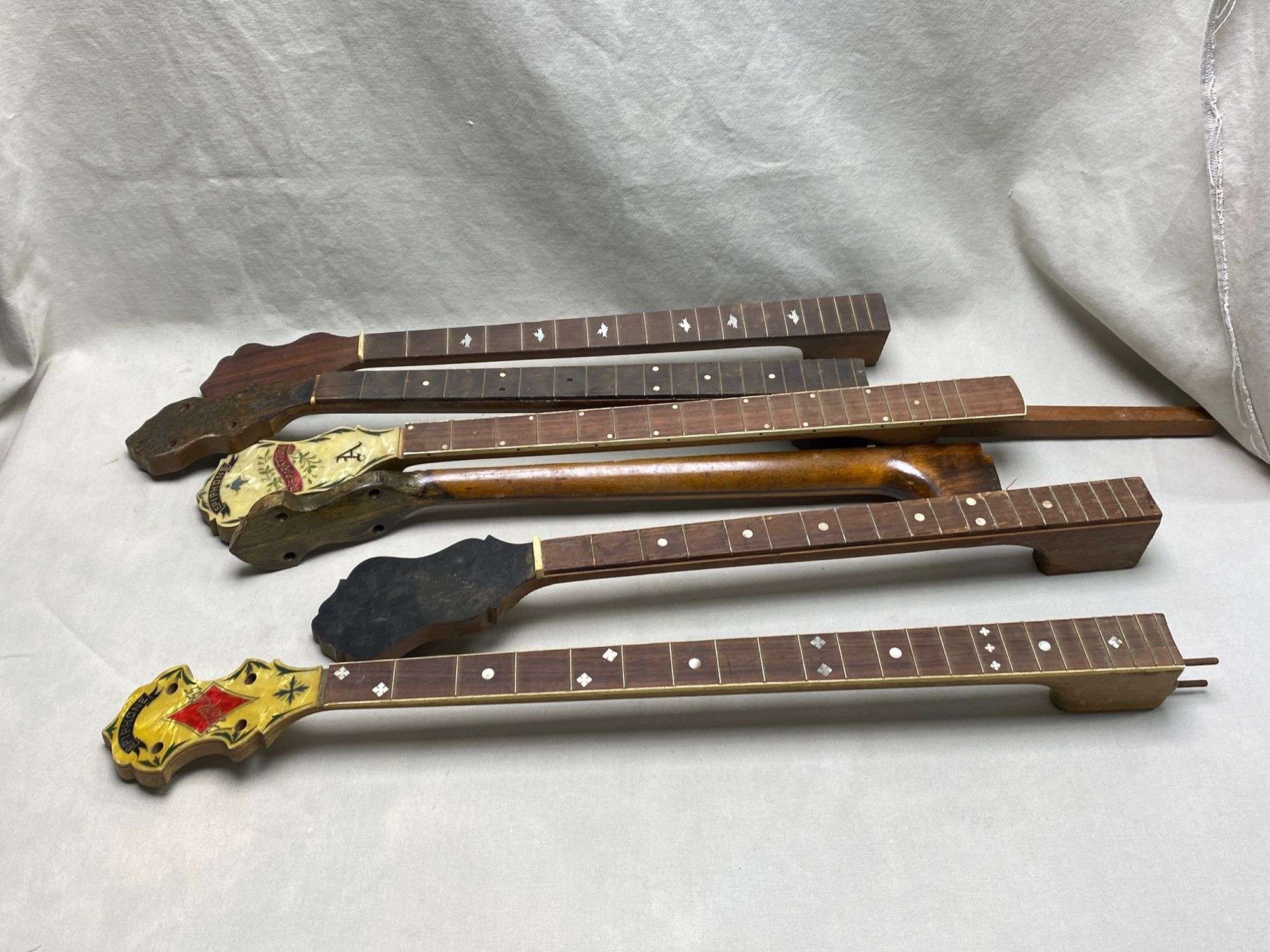 Appraisal: Lot banjo necksLot banjo necks All guitars and stringed instruments