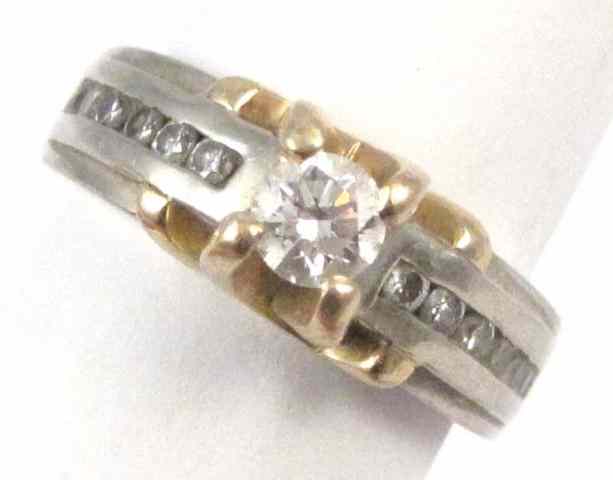 Appraisal: DIAMOND AND FOURTEEN KARAT GOLD RING The yellow and white