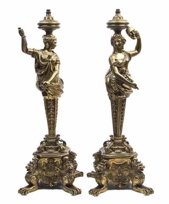 Appraisal: A Pair of Continental Gilt Bronze Figural Lamps each cast