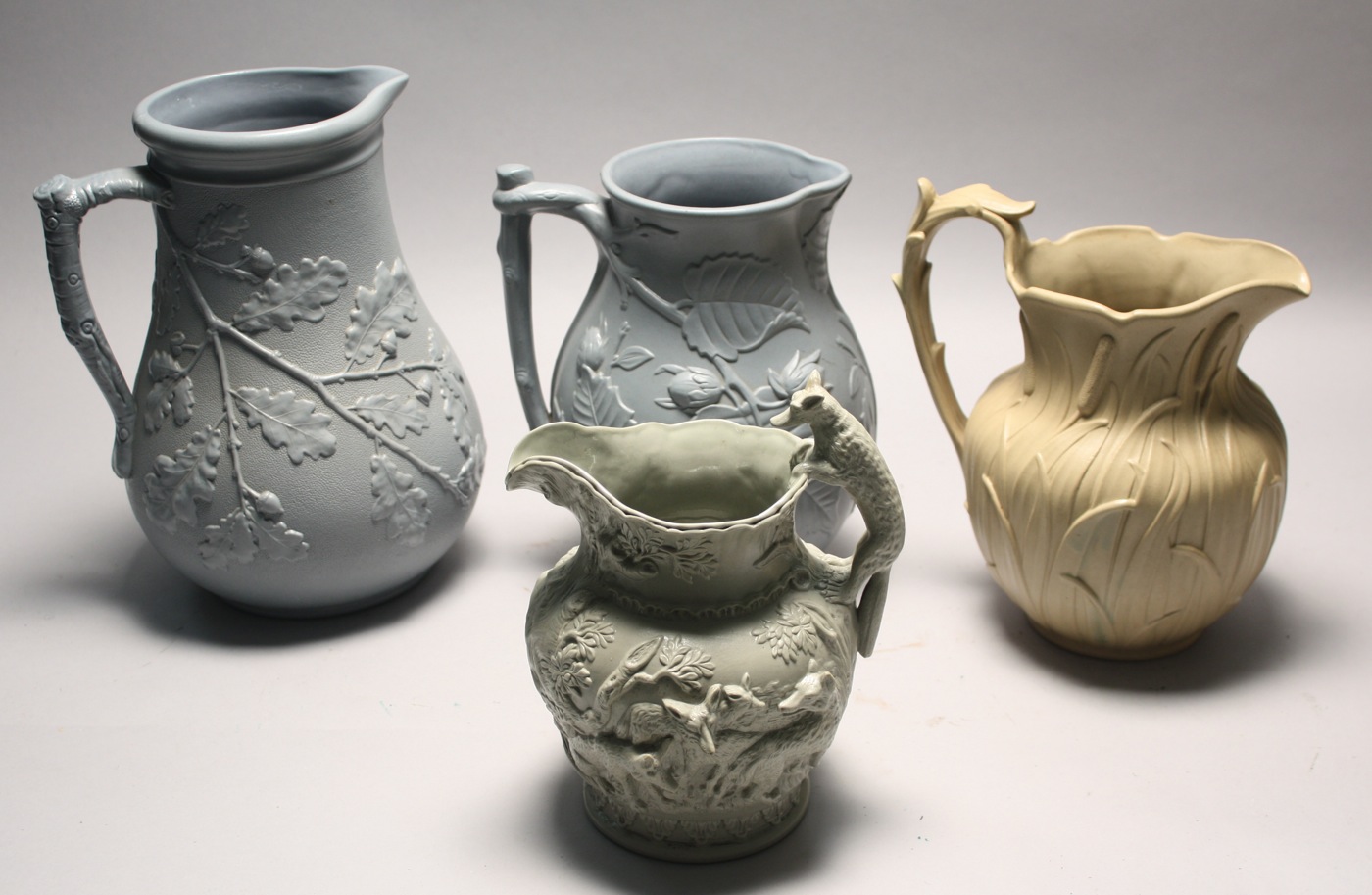 Appraisal: FOUR PIECES OF SALT GLAZE AND SALT GLAZE-STYLE PITCHERS Late