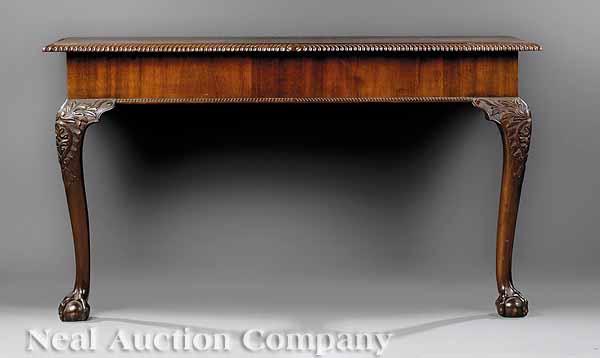 Appraisal: A Pair of Chippendale-Style Mahogany Console Tables c the tops