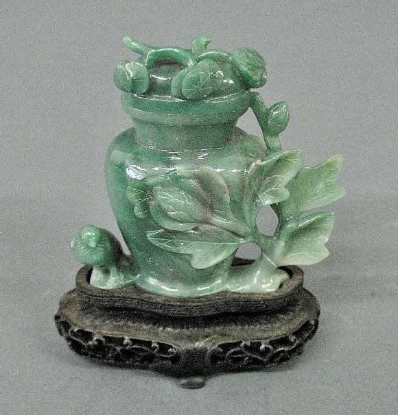 Appraisal: - Carved green jade covered vase on a wood stand