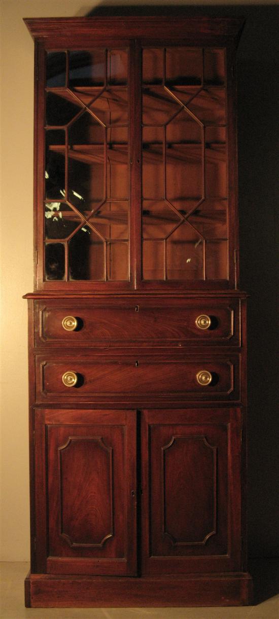 Appraisal: Early th century mahogany bookcase cabinet with two glazed doors