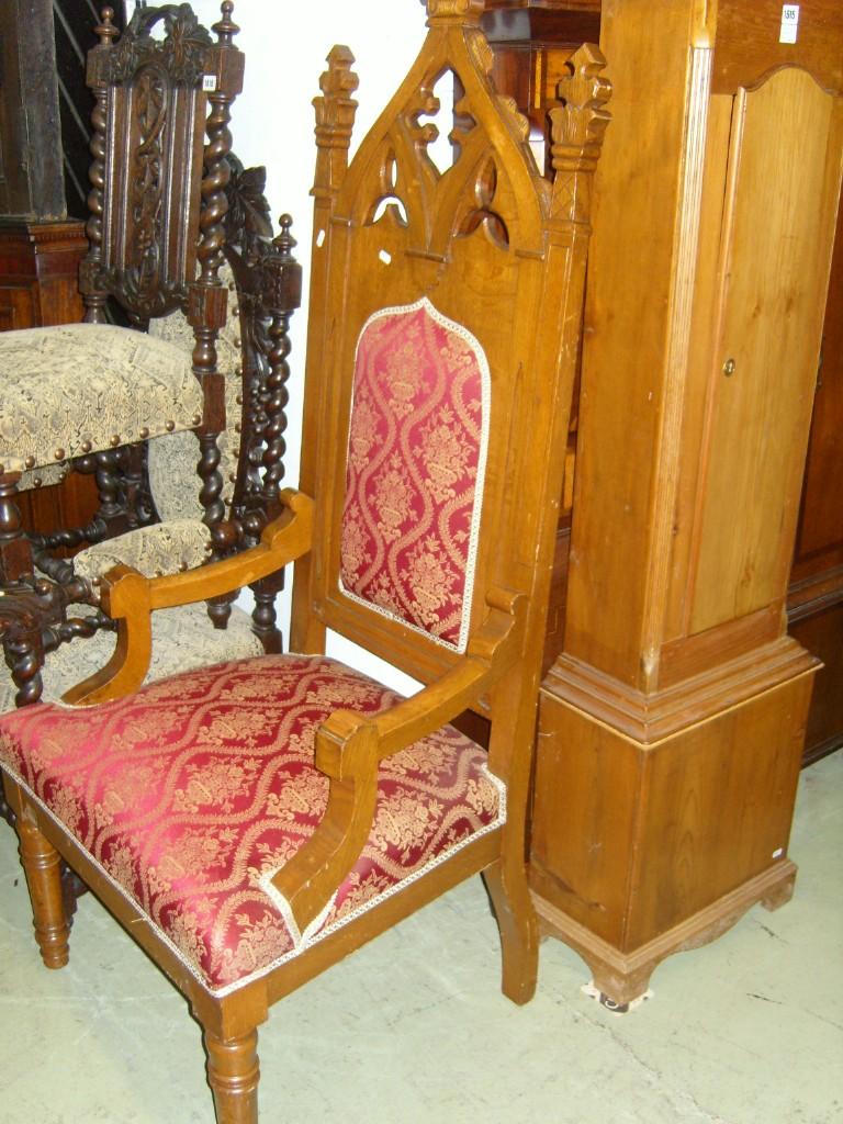 Appraisal: A Victorian oak throne chair with upholstered seat and back