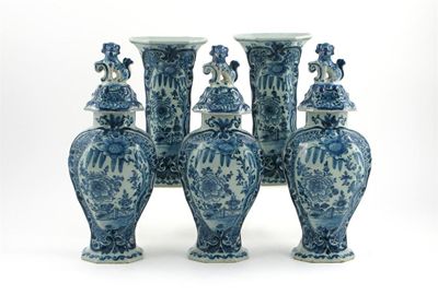 Appraisal: A Dutch Delft garniture of three octagonal baluster vases and