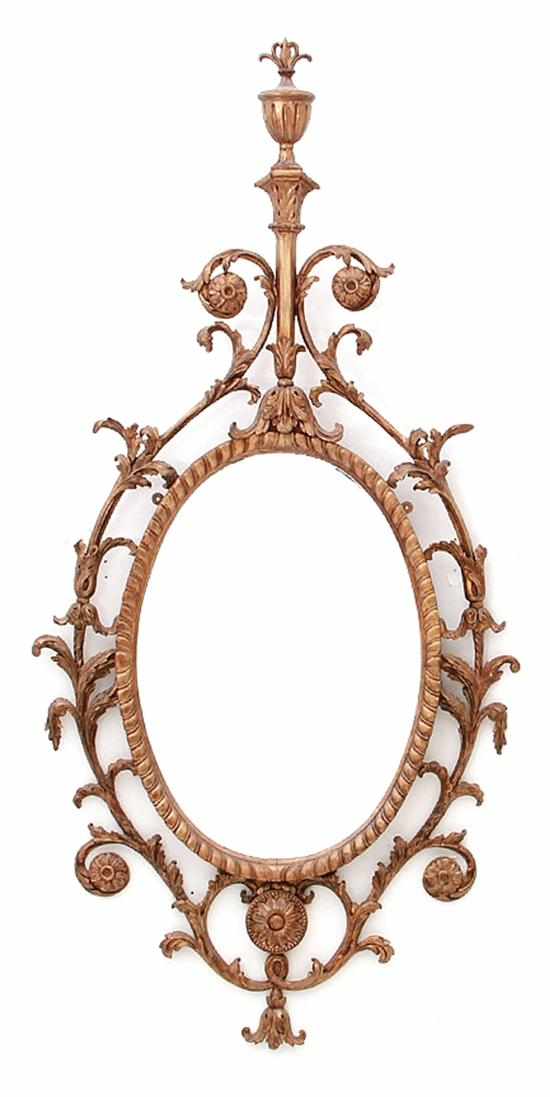 Appraisal: Georgian style mirror th century urn pediment cresting floral and