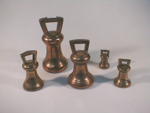 Appraisal: A graduated set of bronze bell weights stamped Market Deeping