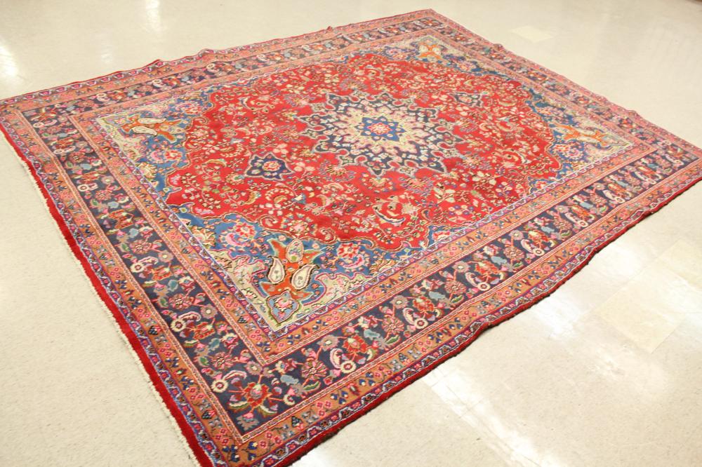 Appraisal: HAND KNOTTED PERSIAN CARPET floral and central floral medallion design